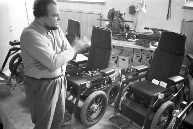 Permobil founder Per Udden looks at some of the original chairs